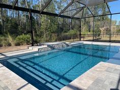 an empty swimming pool in the middle of a wooded area