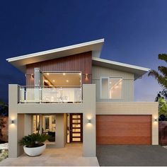 a modern house at night with palm trees