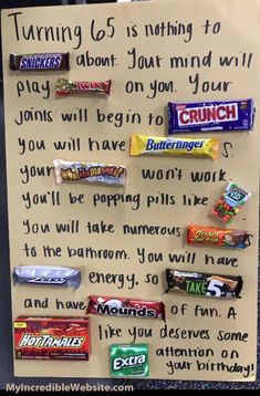 a paper sign with candy bars on it