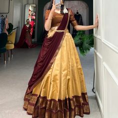 Crafted with love, adorned with heritage : The South-style Kanchipuram silk lehenga is more than just attire; it's a piece of art that encapsulates the essence of South Indian culture 🪸 ll12l Lehenga(Stitched) Lehenga Fabric : Kanchipuram Lehenga Work : Zari Weaving Work Lehenga Waist : SUPPORTED UP TO 42 Lehenga Closer : Drawstring With Zip Stitching : Stitch With Canvas Length : 41 Flair : 3.70 Meter Inner : Micro Cotton Blouse(Unstitched) Blouse fabric : Kanchipuram Blouse Work : Zari ... Cotton Saree Lehenga Designs, Kerala Wedding Outfits Sisters, Onam Aesthetics, Dhavani Half Saree Color Combos, South Indian Traditional Dress, Copper Lehenga, South Indian Attire, Kanchipattu Lehenga