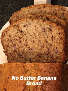 three slices of banana bread on a white plate with the words no butter banana bread