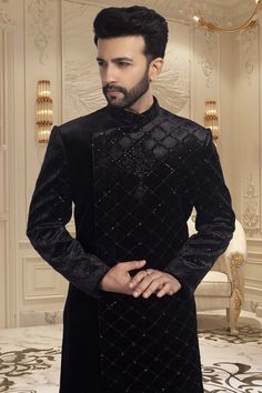 This black sherwani is adorned with delicate cutdana and shimmering sequins, making it an exquisite choice for sangeet ceremonies or reception nights. The perfect choice for any wedding, this sophisticated piece will have you looking and feeling your best. Bollywood Style Wedding Sherwani For Winter, Bollywood Style Sherwani For Wedding In Winter, Bollywood Style Sherwani For Winter Weddings, Black Sherwani For Party And Festivals, Black Formal Kurta For Festivals, Black Long Sleeve Kurta For Wedding, Bollywood Style Bandhgala For Winter Wedding, Winter Wedding Bollywood Bandhgala, Long Sleeve Sherwani For Festive Party