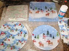 christmas plates and napkins are sitting on the counter