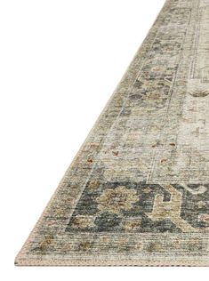 a large rug with an ornate design on the top and bottom, in grey tones