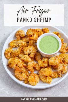 air fryer panko shrimp on a white plate with dipping sauce in the middle