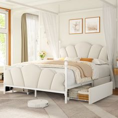 a white bed sitting in a bedroom on top of a hard wood floor next to a window