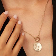 Our Majesty Coin Necklace features the distinguished profile of King George, a symbol of regal heritage and history. Crafted with precision, the Majesty Coin Necklace is perfect for those who appreciate historical significance combined with contemporary style. Wear it solo for a minimalist look or layer it with other pieces for a chic statement. Classic Tarnish Resistant Necklace For Formal Occasions, Classic Formal Tarnish-resistant Necklaces, Heirloom Brass Jewelry With Coin Pendant, Heirloom Style Brass Necklace, Tarnish Resistant, Heirloom Brass Necklace Tarnish Resistant, Heirloom Brass Necklace With Coin Pendant, Classic 14k Gold Coin Pendant Jewelry, Classic 14k Gold Jewelry With Coin Pendant, Classic Yellow Gold Jewelry With Clavicle Chain