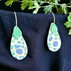 ✨ Dive into the Dreamy Depths of Blue with Our Stained Glass Teardrop Earrings! ✨ Elevate your accessory game with these enchanting 1-inch long dangle earrings that are as unique as you are! Handcrafted with love, each pair showcases a stunning stained glass design featuring mesmerizing shades of blue, aqua, navy, and white. The translucent effect catches the light beautifully, creating a magical shimmer that will turn heads wherever you go. But that's not all - these earrings are not just about style! Designed with a delicate teal small teardrop accent, they add a splash of color that perfectly complements the intricate stained glass pattern. Plus, we've used lightweight yet sturdy polymer clay, ensuring you can wear them all day long without a care. Crafted with sterling silver ear hoops Unique Hypoallergenic Teardrop Dangle Earrings, Nickel Free Blue Teardrop Earrings, Hypoallergenic Blue Teardrop Pendant Earrings, Unique Green Teardrop Earrings For Gift, Unique Hypoallergenic Teardrop Earrings, Blue Teardrop Drop Earrings, Nickel-free Blue Teardrop Earrings, Nickel Free Blue Teardrop Pendant Earrings, Blue Long Drop Teardrop Earrings