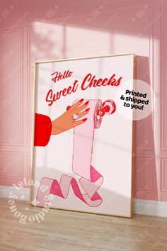 a pink poster with the words hello, sweet checks printed and displayed in front of a pink wall