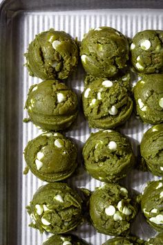 green cookies with white chocolate chips in a baking pan