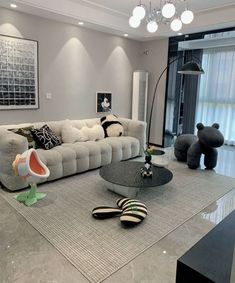 a living room filled with lots of furniture and decor