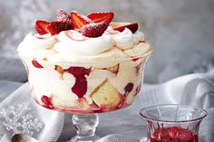 a trifle with strawberries and whipped cream on top