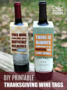 two bottles of wine sitting next to each other on top of a wooden table with the words diy printable thanksgiving wine tags