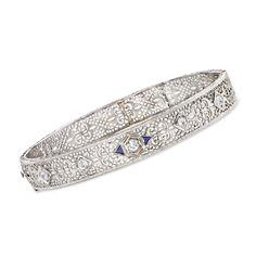 Ross-Simons - C. 1950 Vintage .50ct t. w. Diamond, .12ct t. w. Synthetic Sapphire Filigree Bangle Bracelet. 7". C. 1950. Achieving a look of elegance can be as simple as finishing off your outfit with an ornate bracelet. From our Estate collection, this Retro-era bangle is crafted of filigree openwork in 14kt white gold and sparked by .50 ct. t. w. round Old European-cut diamonds and .12 ct. t. w. trillion-cut synthetic sapphires. Hinged with a figure 8 safety. Box clasp, synthetic sapphire and Vintage Platinum Diamond Bracelet With Single Cut Diamonds, Vintage Platinum Bracelets With Diamond Accents, Vintage White Gold Diamond Jubilee Bracelet, Vintage White Gold Bracelet With Single Cut Diamonds, Vintage White Gold Bracelets With Single Cut Diamonds, Vintage Diamond Bracelet With Single Cut Diamonds For Wedding, Vintage Platinum Diamond Bracelet For Formal Occasions, Vintage White Gold Diamond Bracelet, Vintage Diamond Accents Bracelet For Formal Occasions