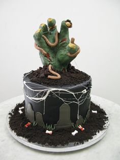 there is a cake that has been decorated to look like zombies