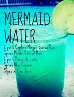 a jar filled with green liquid next to a swimming pool and the words mermaid water