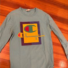 Retro Vintage Look Champion Long Sleeve Size Small Men’s/Unisex Never Worn Perfect Condition Blue Long Sleeve Shirt With Letter Print, Light Blue Long Sleeve T-shirt For Streetwear, Retro Multicolor Long Sleeve T-shirt, Collegiate Long Sleeve Relaxed Fit T-shirt, Retro Long Sleeve Soft-washed Sweatshirt, Yellow Champion Hoodie, Champion Vintage Sweatshirt, Vintage Looks, Long Sleeve Tees