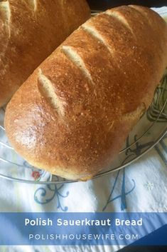 two loaves of bread sitting on top of a glass plate with the words polish sauerkraut bread