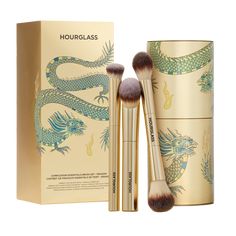 Meet the ultimate complexion-perfecting trio: an assortment of our most coveted complexion brushes. Available in a limited-edition gold finish exclusively for Holiday 2024, these multi-tasking brushes come packaged in a custom-designed tin canister featuring artwork by London illustrator Katie Scott. Brushes Included: Ambient Soft Glow Foundation Brush – Designed to mimic the delicate and precise control of the fingertips, this cruelty-free brush features unique vegan fiber technology and custom bristles for effortless blending and intuitive, even application. Vanish Seamless Finish Concealer Brush - A high-performance concealer brush that delivers unprecedented precision and blending, featuring a unique half-moon shape for controlled application to the contours of the face, especially und Katie Scott, Tin Canisters, Holiday Beauty, Glow Foundation, Free Brush, Concealer Brush, Moon Shapes, Beauty Gift Sets, Foundation Brush