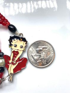 Vintage Betty Boop necklace , red and black beads Party Red Beaded Necklaces With Black Beads, Red Necklace With Black Beads For Party, Gift Red And Black Beaded Necklaces, Red And Black Beaded Necklaces For Gifts, Red And Black Beaded Necklace For Gift, Gift Red Beaded Necklaces With Black Beads, Red Beaded Necklaces With Black Beads For Gifts, Red Necklace With Black Beads For Gift, Red Necklace With Black Beads As Gift