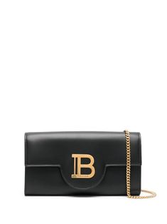 Elevate your accessorizing game with this Balmain Buzz Wallet Designed for the modern woman of FW24 Made from luxurious and durable calf leather Lined with soft and smooth lambskin Complete with a stylish chain for added flair The perfect small leather good for any outfit or occasion Upgrade your accessories collection with this versatile piece Balmain Bag, Wallet On Chain, Black Leather Wallet, Leather Cap, Mini Wallet, Wallet Chain, Logo Stamp, Small Leather Goods, Jet Black