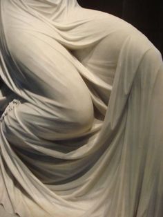 an image of a woman covered in white cloth