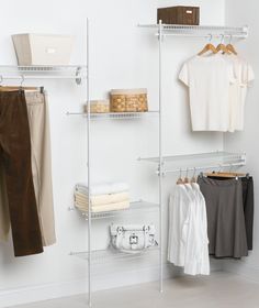 an organized closet with clothes, shoes and other items hanging on the wall next to it