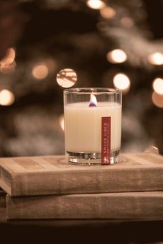 a candle sitting on top of a book