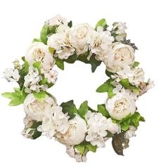 a wreath with white flowers and green leaves