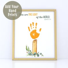 an orange hand print with the words, you are the light of the world