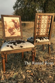 two chairs sitting in the middle of a field with pictures on them and one has a cow print seat pad