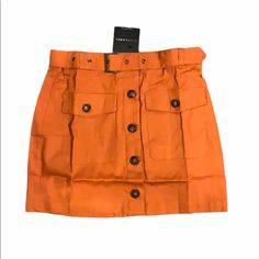 Nwt Jluxlabel Orange Archer Button Up Mini Skirt -Size: Large -Measurements Approx: Hip To Hip: 15 7/8”(Not Stretch) -Total Length: 15” -Color: Orange -Material: 97% Cotton/3% Cotton -Style: Removable Belt; 2 Front Pockets; Button Up -Style #: Ibk3046orange-3 -Brand Is: Blue Blush -Condition: New W/ Tags In Packaging -Color May Vary On Device -All Original Photos -Accurately Described & Represented -Final Sale. Backed By Pm Buyer Protection. Buyer Agrees To & Understands Condition Of Item. Orange Relaxed Mini Skirt With Lining, Orange Fitted Retro Mini Skirt, Orange Mini Skirt With Pockets, Orange Cotton Mini Skirt, Orange Button-up Shirt With Pockets, Orange Material, Cotton Style, Up Styles, Color Orange