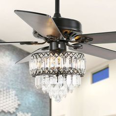 This gorgeous ceiling fan chandelier adds high-end elegance to your living space. The rich traditional design is designed to complement any luxury space, and the attached remote control can easily control lights and fans. Three fan speeds and reversible blades keep you comfortable all year round. When the weather is warm, turn the fan counterclockwise to keep it cool. In cold weather, ensure the comfort of your home environment by reversing the direction of the ceiling fan to push down the warm Wooden Ceiling Fans, Fan Chandelier, Crystal Ceiling Fan, Indoor Chandelier, Black Ceiling Fan, Chandelier Bedroom, Fan With Light, Ceiling Fan Chandelier, Fan Lamp