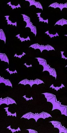 purple bats flying in the night sky