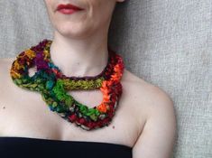 A statement necklace in various vivid hues, made out of sari silk ribbon. A bold piece of jewellery with a bohemian yet delicate spirit that suits many appearances. Comes gift wrapped! Measurements Length from the neck= 25 cm (9,84 inch) Motif length= 9 cm (3,54 inch) Motif width= 18 cm (7,09 inch) Please, you are welcome to read my shop policies page (concerning shipping, refunds, returns, payment), BEFORE purchasing an item. Thank you! For even more silk crochet creations, feel free to visit my shop section "silk crochet necklace": https://www.etsy.com/shop/WearitCrochet?section_id=17463390&ref=shopsection_leftnav_2 Bohemian Crochet Necklace For Party, Artsy Multicolor Necklace For Parties, Fusion Style Multicolor Necklaces For Party, Multicolor Fusion Necklaces For Party, Fusion Style Multicolor Party Necklaces, Fusion Multicolor Party Necklaces, Free Form Crochet, Silk Crochet, Yarn Necklace