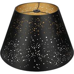 a black and gold lamp shade with white dots on the bottom, in front of a white background