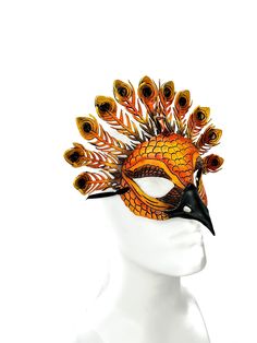 DESCRIPTION This handmade genuine leather bird mask has been designed to resemble the look of a peacock. It has been tooled and shaped by hand and then brush painted and airbrushed to finish. Please note, the top feathers are a bit thinner than many of our masks and so are slightly more bendable/fragile.  ALL OF OUR MASKS ARE FULLY CUSTOMIZABLE  Each leather mask can be customized to change the color, alter the appearance, or to add additional accessories such as stones or crystals. Please inclu Bird Mask, Bird Masks, Wall Mask, Blue Peacock, Costume Masks, Leather Mask, Fun Events, Metallic Blue, Halloween Masks