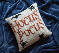 a cross stitch pillow that says hockie's pooches on it