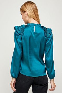 long sleeve top with pleated ruffle detail. Elegant Blue Tops With Ruffle Hem, Chic Blue Tops With Pleated Sleeves, Pleated Sleeve Tops For Fall Party, Fall Party Tops With Pleated Sleeves, Party Tops With Ruffle Hem And Long Sleeves, Long Sleeve Party Top With Ruffle Hem, Fall Party Tops With Ruffled Collar, Party Long Sleeve Top With Ruffle Hem, Pleated Ruffle Sleeve Blouse For Fall