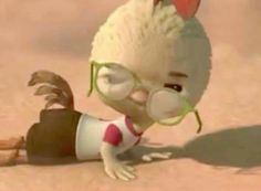 a cartoon character with glasses and a hairdo is laying on the ground in the sand