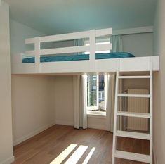 there is a bunk bed in the corner of this room with a ladder up to it