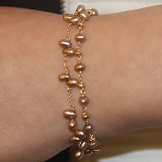 Golden-colored pearls connect with gold-filled chains and gold-filled roundels to form a versatile bracelet that stuns. Size: 7-8" adjustable. Handcrafted at Mabel’s San Francisco atelier Artisan Bracelets, Golden Chain, Fresh Water Pearls, Water Pearls, Pearl Color, Golden Color, Gold Filled Chain, Bead Bracelet, Infinity Bracelet