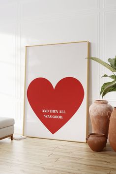 a red heart with the words and then all was good on it next to two vases