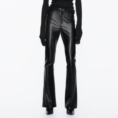 High Waist - Flared Leg - Full Length - Stretch Five Pocket Pants With A High Waist. Long Flared Legs. Front Zip And Metal Button Closure. Edgy Non-stretch Full Length Pants, Faux Leather Full-length Pants For Fall, Fall Faux Leather Full-length Pants, Fall Full-length Faux Leather Pants, Edgy Full-length Leather Pants For Spring, Edgy Trousers For Fall, Non-stretch Faux Leather Pants For Fall, Sleek Wide Leg Leather Pants For Going Out, Trendy Fitted Faux Leather Pants