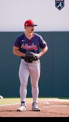 a baseball player is standing on the field