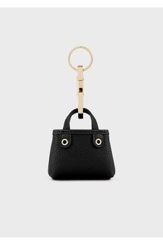 In the big family of small leather goods, MyEA is introducing a new small accessory with a big impact: a deer-print charm that picks up all the features of the iconic MyEA bag in every way, but on a smaller scale. With a practical ring and carabiner, this charm will add a fresh, youthful feel to all bags and accessories in the line. Silkscreen logo. Coordinate this exclusive accessory with your MyEA bag. Dimensions: 10.5 x 9 x 3 cm. Everyday Handheld Coin Purse With Removable Pouch, Modern Leather Wallet For Shopping, Everyday Pouch With Detachable Top Handle, Chic Wallet With Detachable Handle For Daily Use, Black Wallet With Gold-tone Hardware For Everyday Use, Elegant Rectangular Bag Charm, Leather Wallet With Gold-tone Hardware, Chic Wallets With Gold-tone Hardware, Black Wallets With Gold-tone Hardware