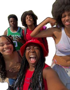 a group of young women standing next to each other with their mouths open and tongue out