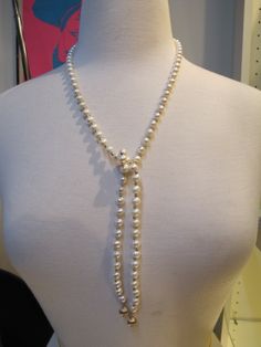 "Elegant, but fun vintage pearl and alternating gold bead necklace. Necklace is open at the front, you can knot it yourself at whatever length you choose. It oddly has a magnetic clasp at the back.  Each pearl measures approximately 7.5mm. Each gold bead measures approximately 3.2mm. Total length 36\" and total weight of 51 grams.   10650-100" Elegant Adjustable Lariat Necklace With Round Beads, Formal Adjustable Pearl Chain Beaded Necklace, Elegant Adjustable Beaded Necklace With Pearl Drop, Formal Adjustable Beaded Pearl Necklace, Lariat Pearl Necklace With Charm For Parties, Elegant Beaded Lariat Necklace, Elegant Adjustable Beaded Lariat Necklace, Beaded Lariat Pearl Necklace, Pearl Lariat Beaded Necklace