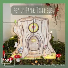 an image of a paper tree house made out of wood and moss with the words pop up paper treehouse on it