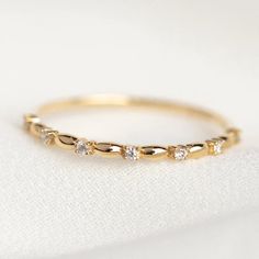 Make room for elegant texture on your ring stack with this beautiful 14k solid yellow gold ring with sparkling lab diamonds. Wear alone or stacked! Shop more sustainable diamond rings at Local Eclectic. Simple Women Wedding Band, Wedding Band With Birthstone, Stacked Engagement And Wedding Rings, Simple Promise Rings, Gold Wedding Band Women, Wardrobe List, Pearl Wedding Ring, Silver Eternity Ring, Dainty Wedding Band